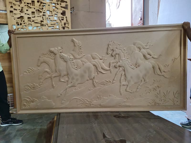 Finished 3D CNC carved relief panel being carried out for dispatch from the Bijwasan unit