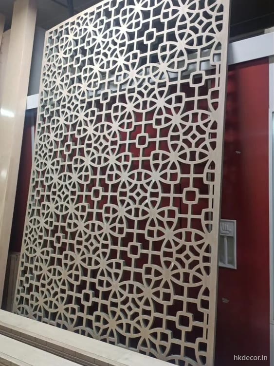 CNC cut MDF jaali partition screen finished in white and fitted across an interior opening