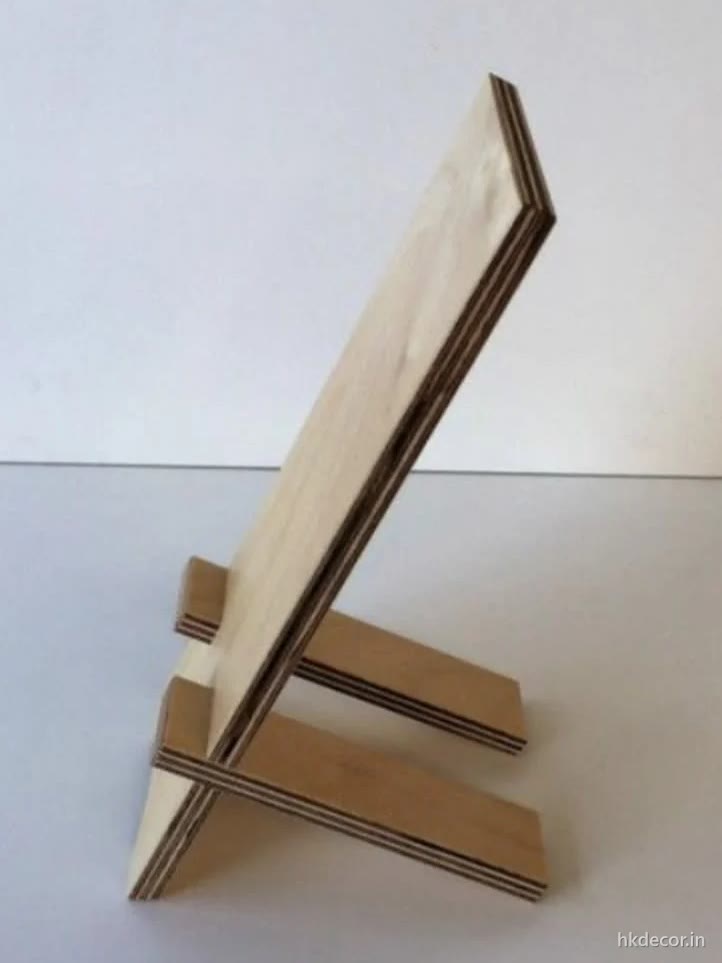 Laser cut two part display stand in thin board that slots together without fixings